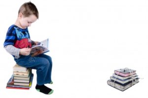 schoolboy-is-sitting-on-books-1388233450gLY
